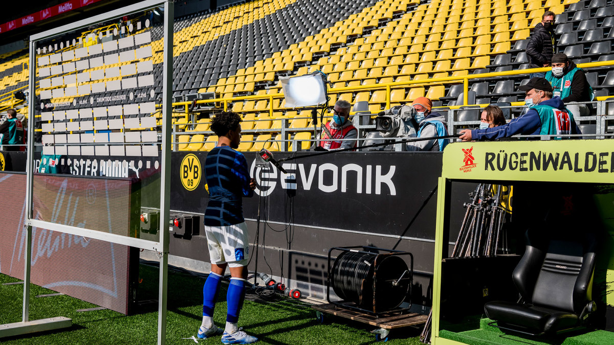 Weston McKennie performs a socially distant TV interview